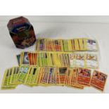 200 assorted PokÃ©mon cards in a Galar Legend Zacian PokÃ©mon V trading card game tin.