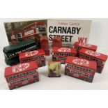 A collection of London related toys and accessories. To include a painted green modern tin plat bus,