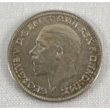 A George V 1932 uncirculated and lustred sixpence coin.