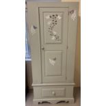 A vintage solid pine 2 part wardrobe, painted grey with stencilled painted design and butterfly