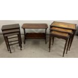 2 vintage dark wood nests of 3 tables together with a magazine rack side table. Mid Century