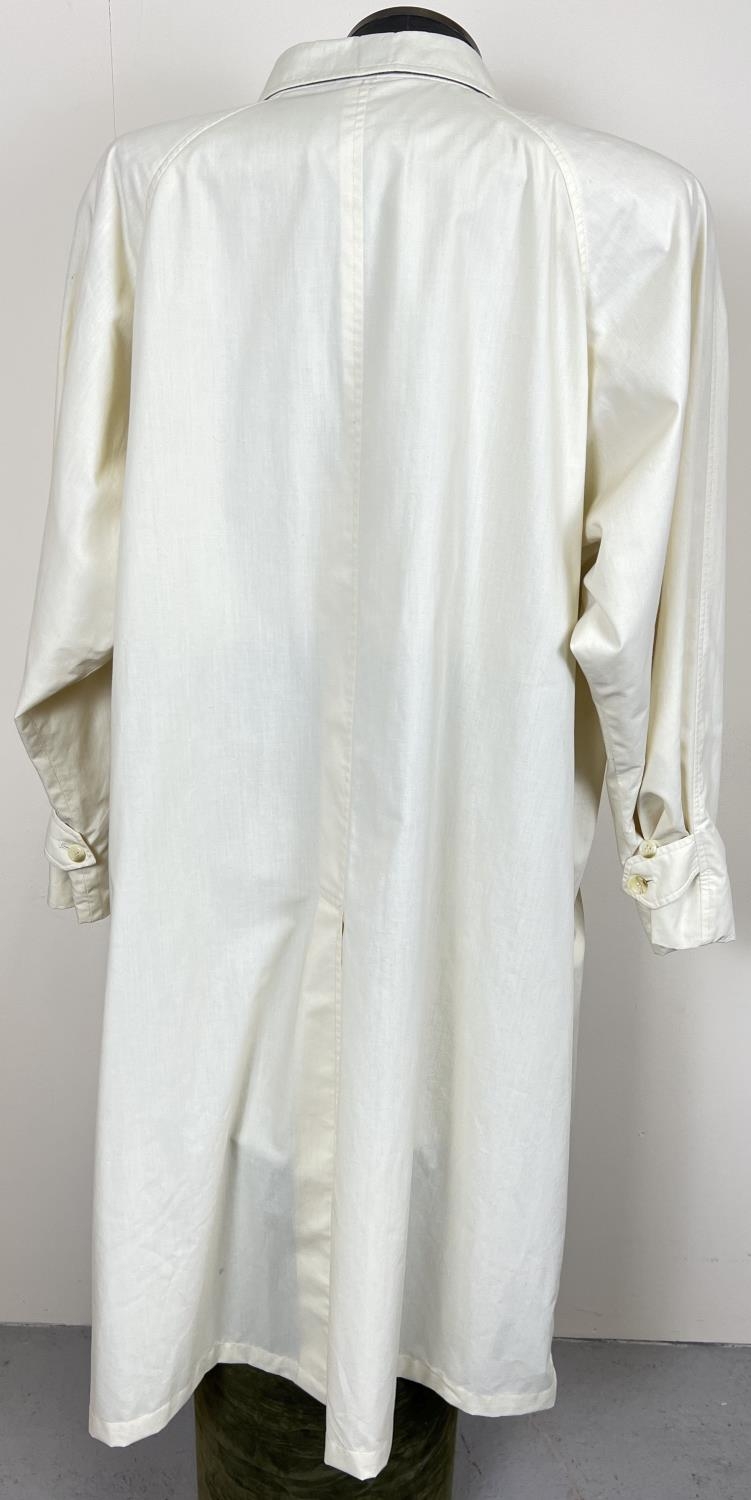 A cream light weight belted trench coat by Burberrys. Front button fastening with 2 front pockets. - Image 4 of 6