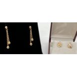 2 pairs of vintage 9ct gold earrings. A pair of flower studs with sun-ray detail, together with a