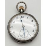 A vintage silver pocket watch with secondary dial. White enamel face with black steel hands Back