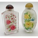 2 vintage oriental interior painted glass snuff bottles of floral design. With coloured glass