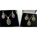 2 sets of silver necklaces with matching drop style earrings. A set with rope detail oval mounts and