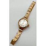 A ladies vintage wristwatch by Regency with 9ct gold case and strap. Bracelet style link strap