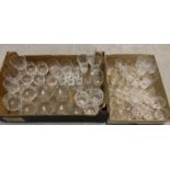 2 boxes containing a large quantity of vintage stemmed cut glasses and crystal glasses. To