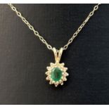 A vintage 9ct gold emerald and diamond set pendant on an 18" fine belcher chain with spring clasp.