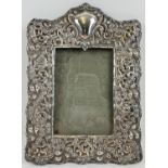 An Edwardian silver fronted picture frame of decorative scroll & foliate design. Hallmarked for