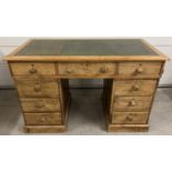 An antique stripped pine 3 piece pedestal knee hole desk. Green leather insert top with gilt detail.