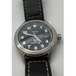 A men's Defender wristwatch by Fossil, DEC1001 111407. Stainless steel case with black face.