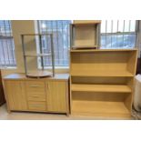 A collection of modern light wood furniture, a small triple sideboard, a large 3 shelf bookcase