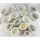 A collection of 15 assorted vintage & antique ceramic jelly & blancmange moulds. In vary sizes and