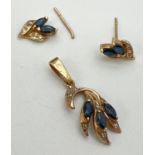 A pair of 9ct gold diamond and sapphire set stud style earrings together with a matching pendant.