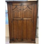 A vintage Old Charm dark oak double wardrobe with linenfold design to doors. Of Gothic design with