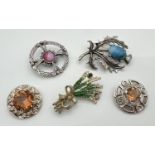 A collection of 5 Scottish brooches to include circular design set with central round orange/brown