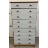 A modern 10 drawer chest of drawers with painted grey drawer fronts. Natural wood finish and knob