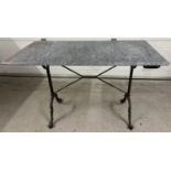 A vintage cast metal based rectangular garden table with marble top. Top has crack (approx. 28cm