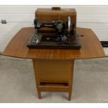 An early 20th century Jones CWS Federation Family hand sewing machine in a vintage sewing machine