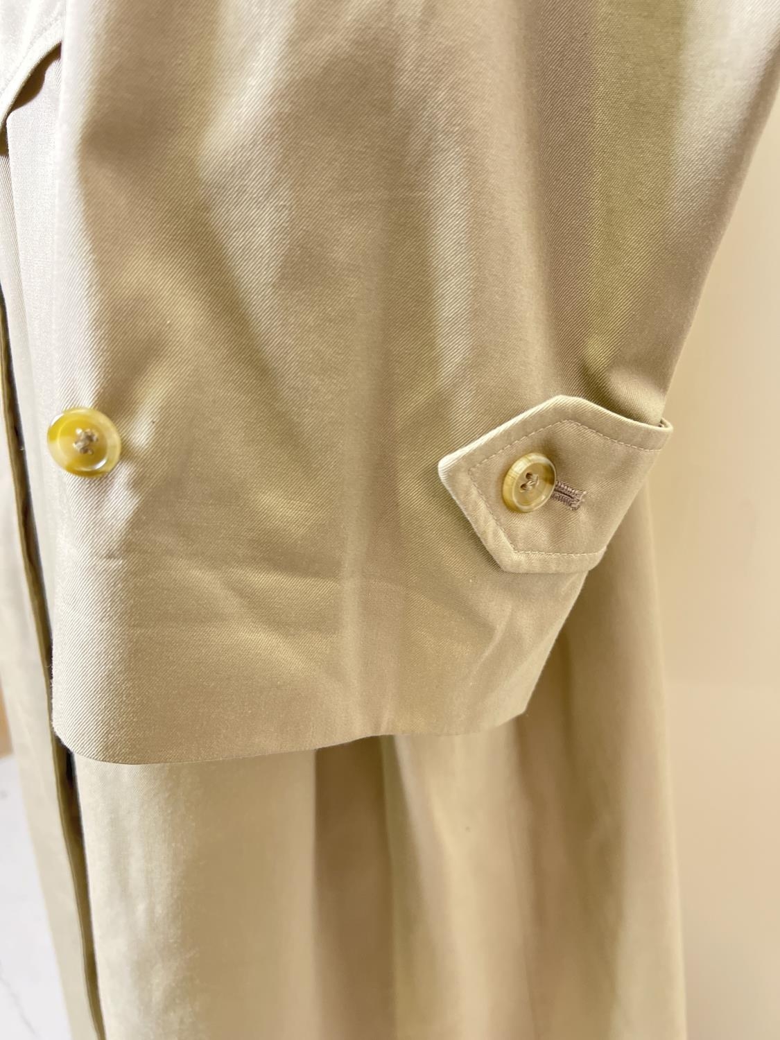 A beige belted long trench coat by Burberrys. Classic check full length lining, button front - Image 3 of 9
