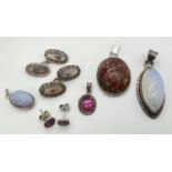 A collection of silver and white metal jewellery set with natural and semi-precious stones. To