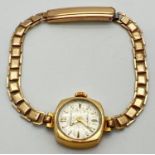 A ladies vintage 9ct gold cased wristwatch by Sekonda, with rolled gold bracelet strap. Hallmarks to