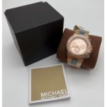 A ladies rose gold tone chronograph wristwatch by Michael Kors, MK5412. Rose gold tone face with