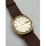 A men's vintage Aquastar Duward Ocenanic wristwatch. Gold tone case, hour markers and hands. With