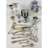 A collection of vintage silver plated items. To include Viners milk jug, golfing trophy cups,