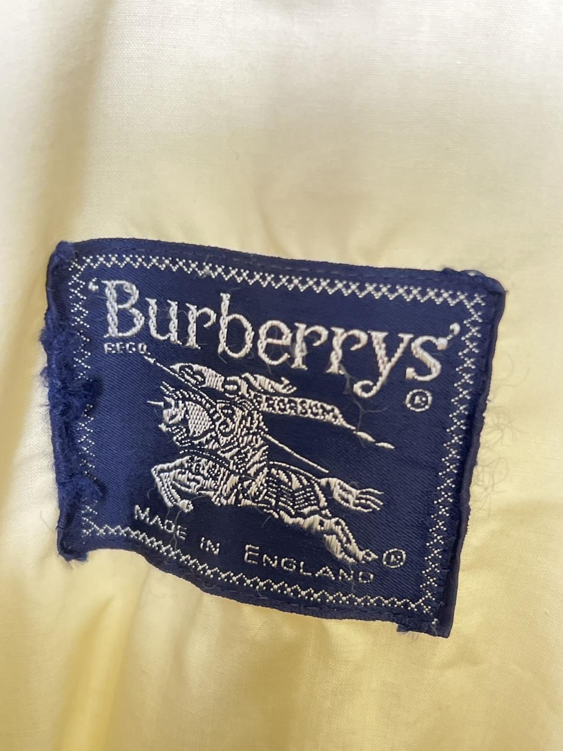 A cream light weight belted trench coat by Burberrys. Front button fastening with 2 front pockets. - Image 6 of 6