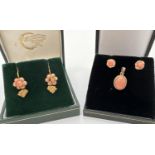 A collection of vintage gold coral set jewellery. An oval pendant with rope design mount set with