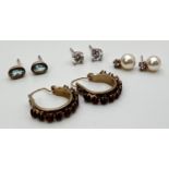 A small collection of silver and costume jewellery earrings. To include oval cut blue topaz studs,