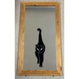 A large, modern pine framed mirror with leaded glass black cat applied design. Complete with hanging