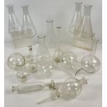 A collection of vintage scientific glass containers, measures and flasks to include conical. Largest