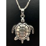 A 925 silver articulated turtle pendant with moving arms, legs & tail. On an 18" silver figaro