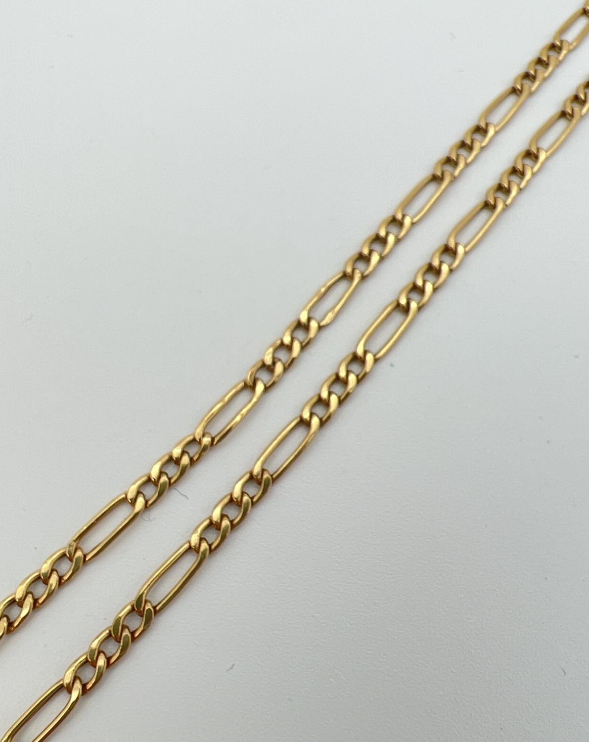 An 18" 9ct yellow gold figaro chain necklace with spring ring clasp. Both hook end links and clasp