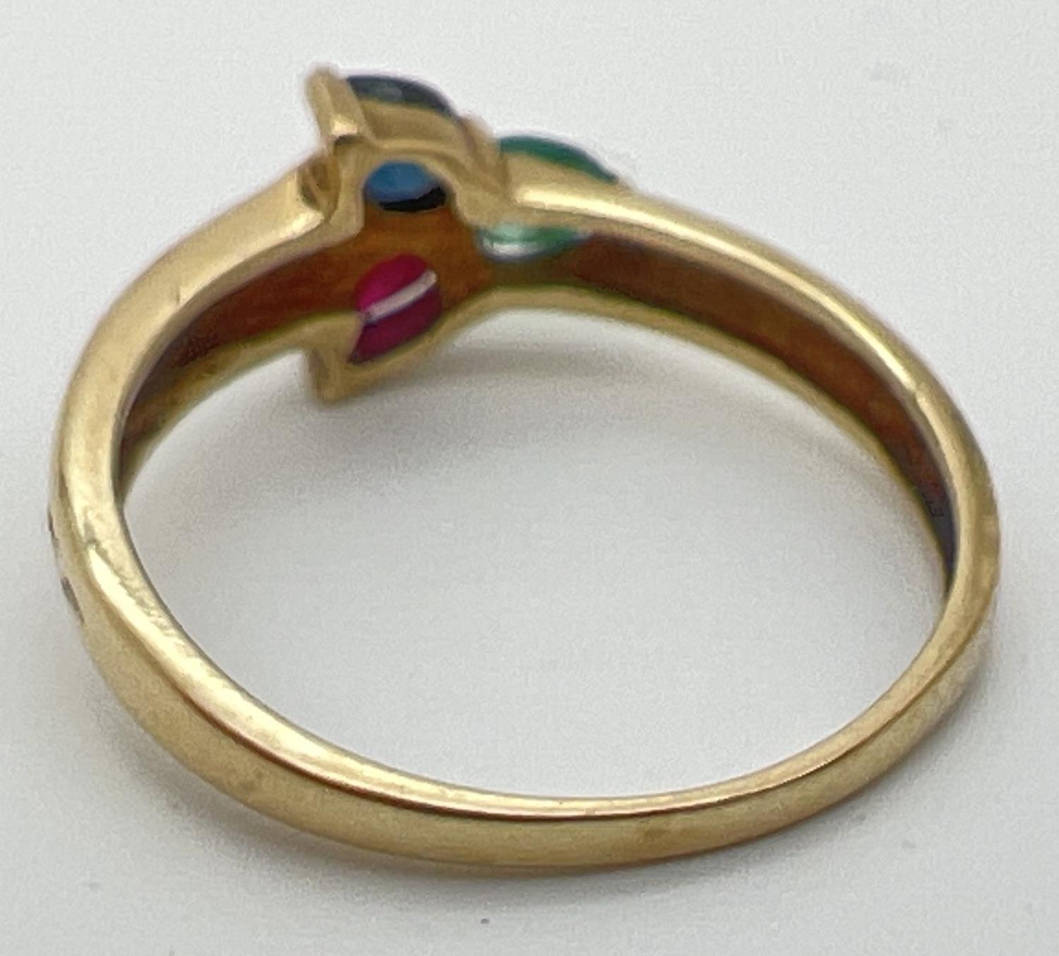 A 9ct yellow gold multi stone trinity ring with a pear cut emerald, sapphire & ruby in a 3 point - Image 3 of 4