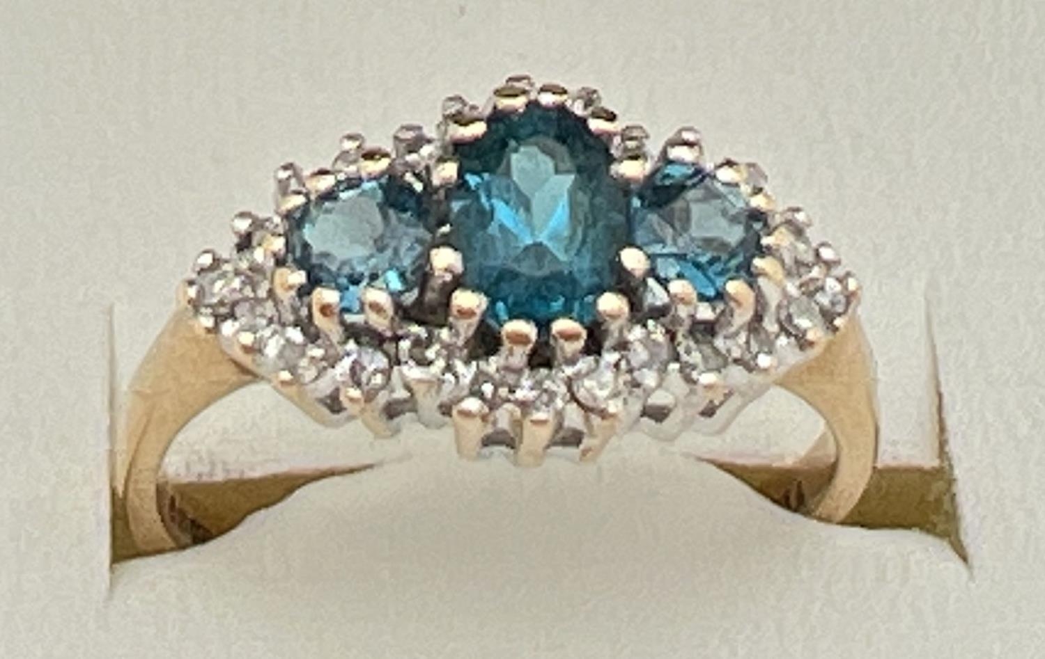A 9ct gold, London blue topaz and diamond ring in a diamond shaped halo setting. Central oval cut - Image 4 of 4