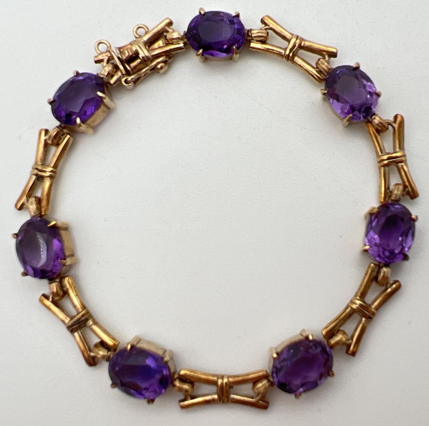 A 9ct yellow gold and amethyst love and kisses style 13 link bracelet of alternating oval cut - Image 4 of 4