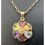 A 9ct gold multi stone pendant on a 9ct gold 18" oval link belcher chain with spring ring clasp.