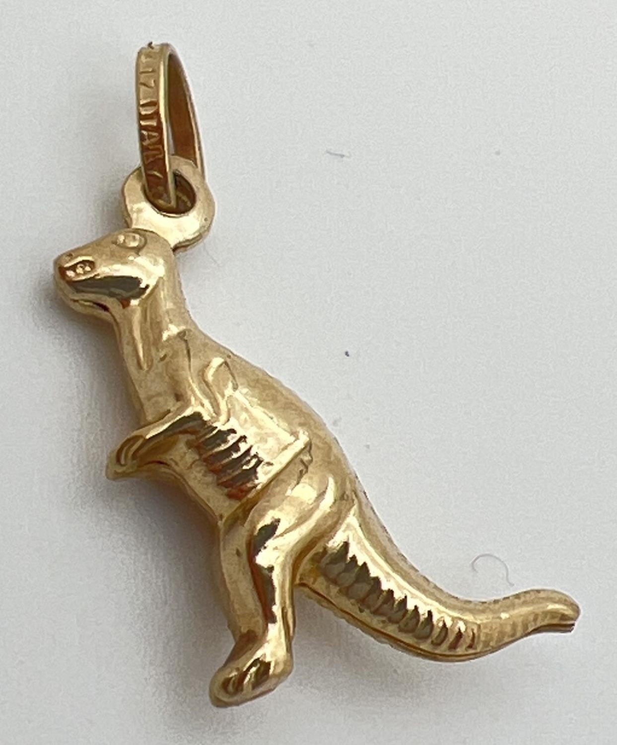 A 10ct gold charm/pendant modelled as a dinosaur. Hanging bale stamped '417 Italy'. Approx. 2cm long - Image 2 of 2