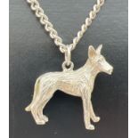 A white metal pendant modelled as a dog an an 18" silver curb chain. Chain approx. 3mm width with