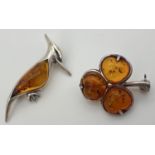 2 small 925 silver and amber brooches. A woodpecker (approx. 3.5cm long) stamped 925 to reverse,