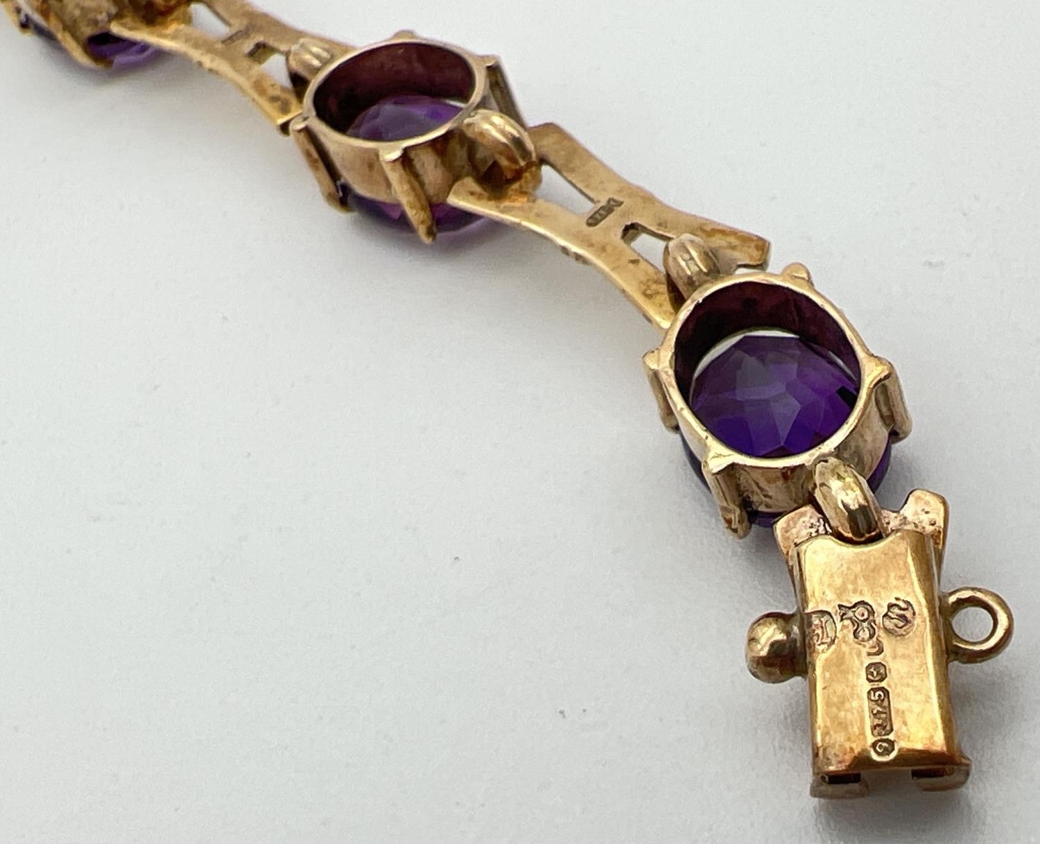 A 9ct yellow gold and amethyst love and kisses style 13 link bracelet of alternating oval cut - Image 2 of 4