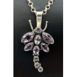 An amethyst set pendant in the shape of a dragonfly on a 17" silver belcher chain. 10 amethyst