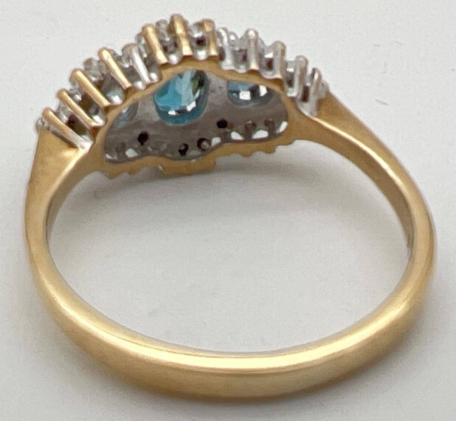 A 9ct gold, London blue topaz and diamond ring in a diamond shaped halo setting. Central oval cut - Image 3 of 4