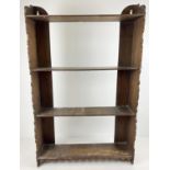 A vintage stained pine wall hanging shelf/bookcase with shaped end panels and 4 shelves. Approx.