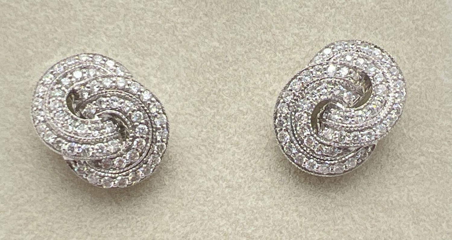 A pair of 18ct white gold Art Deco style twist knot design diamond earrings by Luke Stockley, - Image 3 of 3