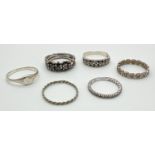 6 silver and white metal band style and signet rings. To include heart shaped set with marcasite's